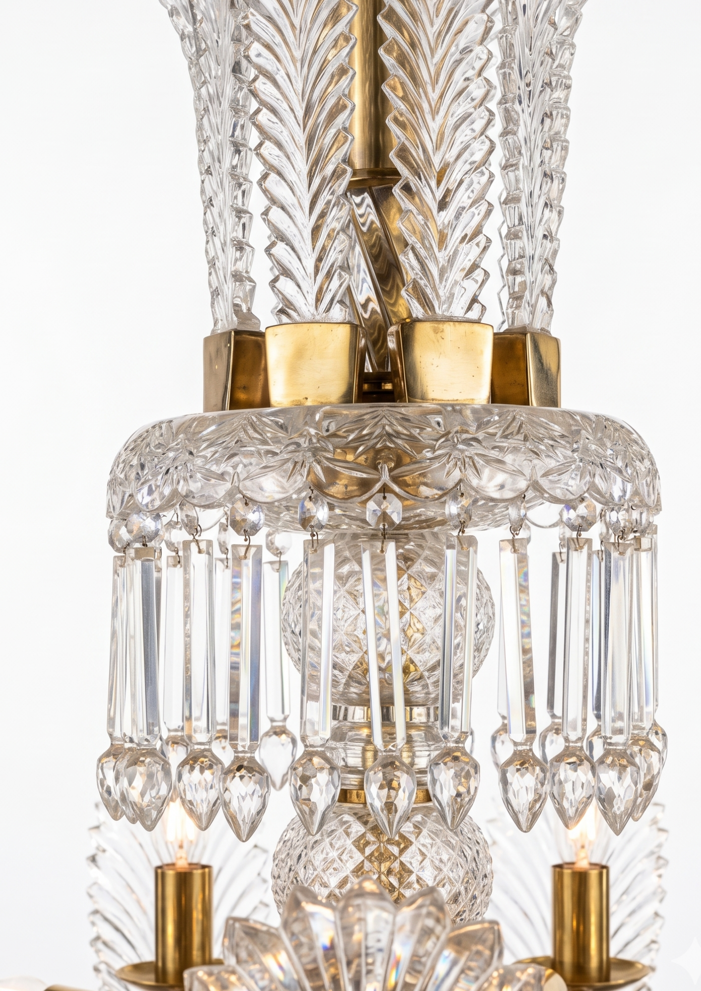 Close-up of a crystal chandelier with gold accents on a white background