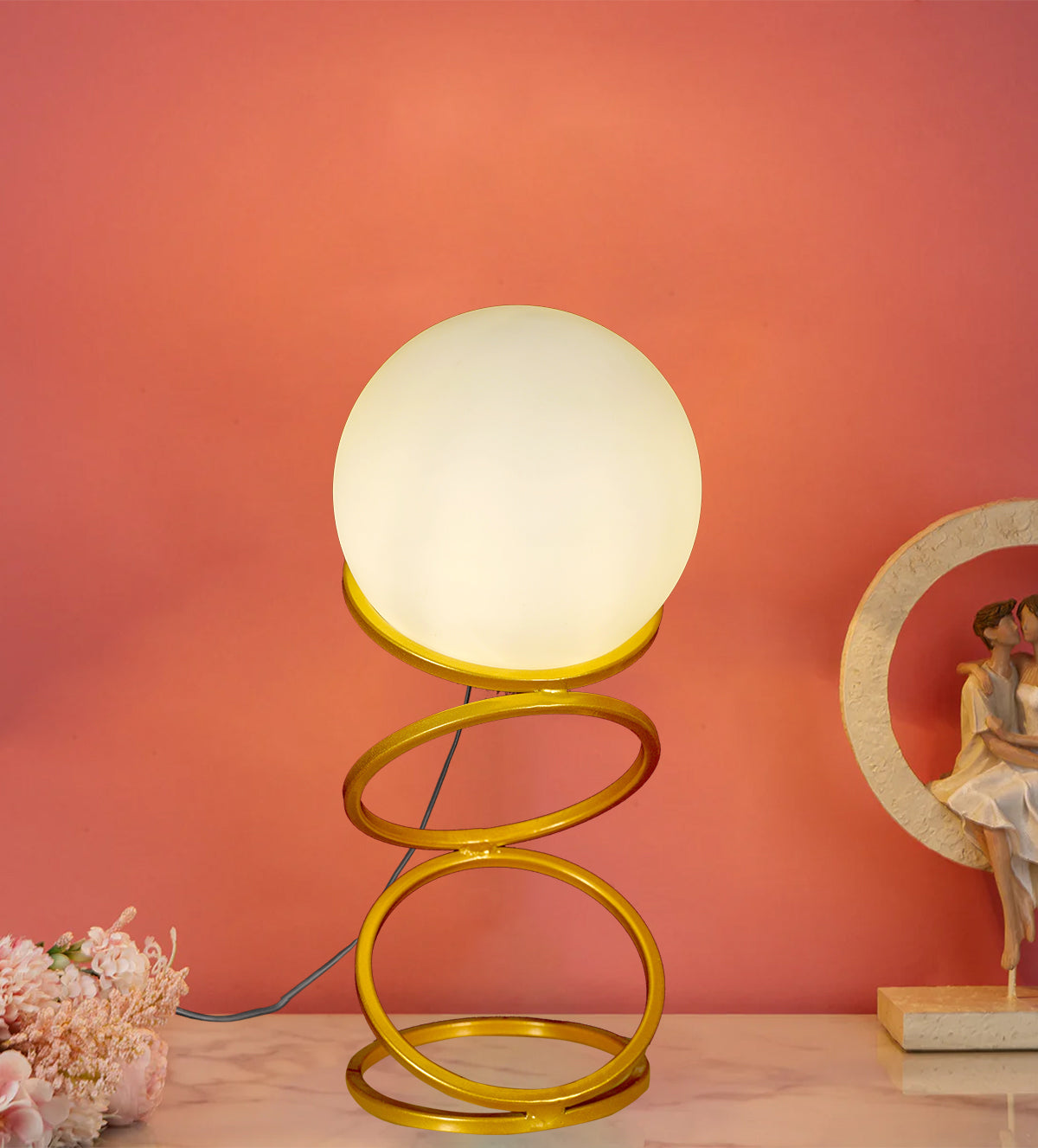 Enhance your space with the Luna Glow Modern Milky Glass LED Table Lamp. This sleek, gold spiral base with a soft-glowing glass globe adds elegance to any room. Shop now for cozy, energy-efficient lighting - Aartaa decor