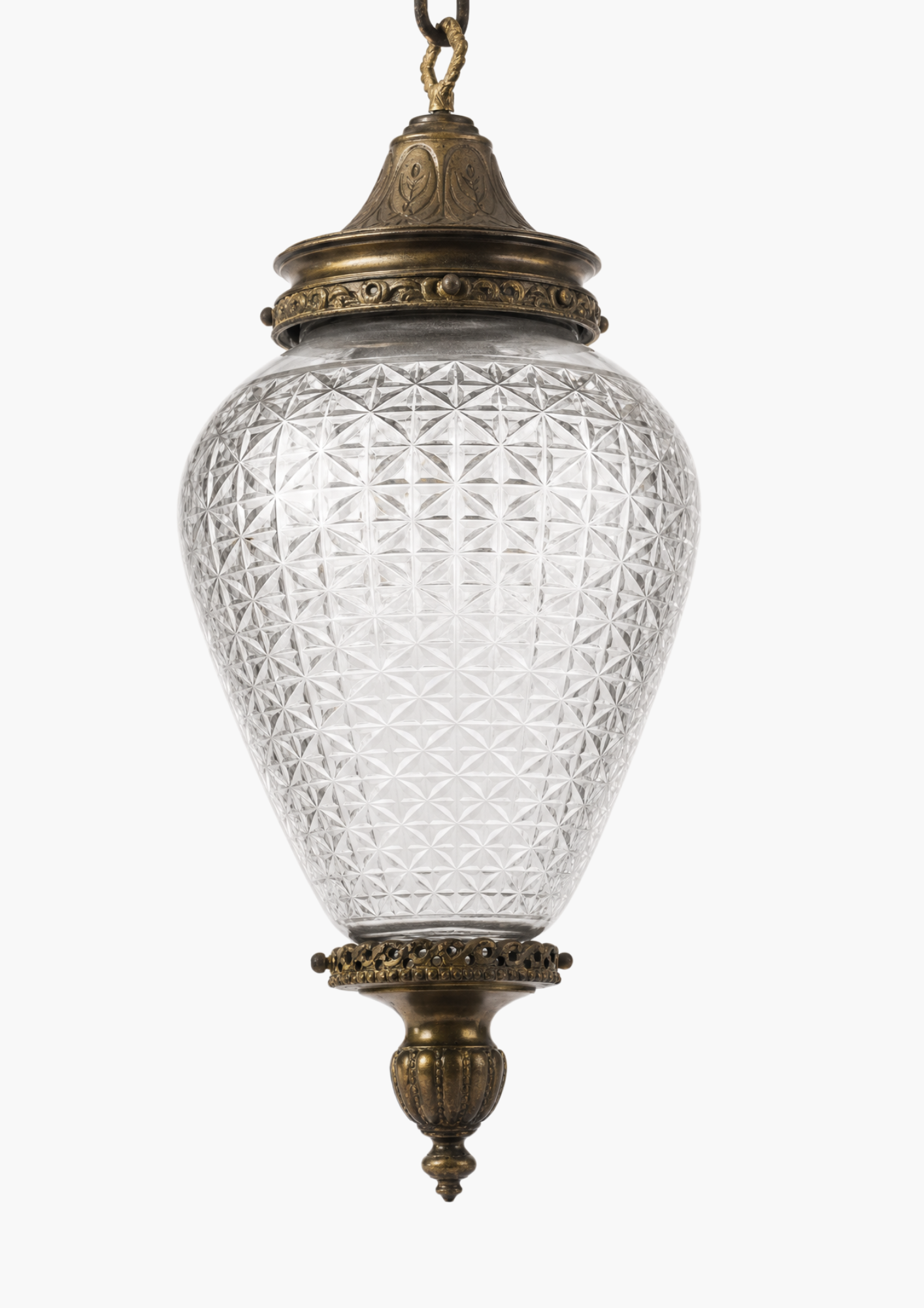 Decorative hanging lamp with textured glass shade and brass fixture on a white background
