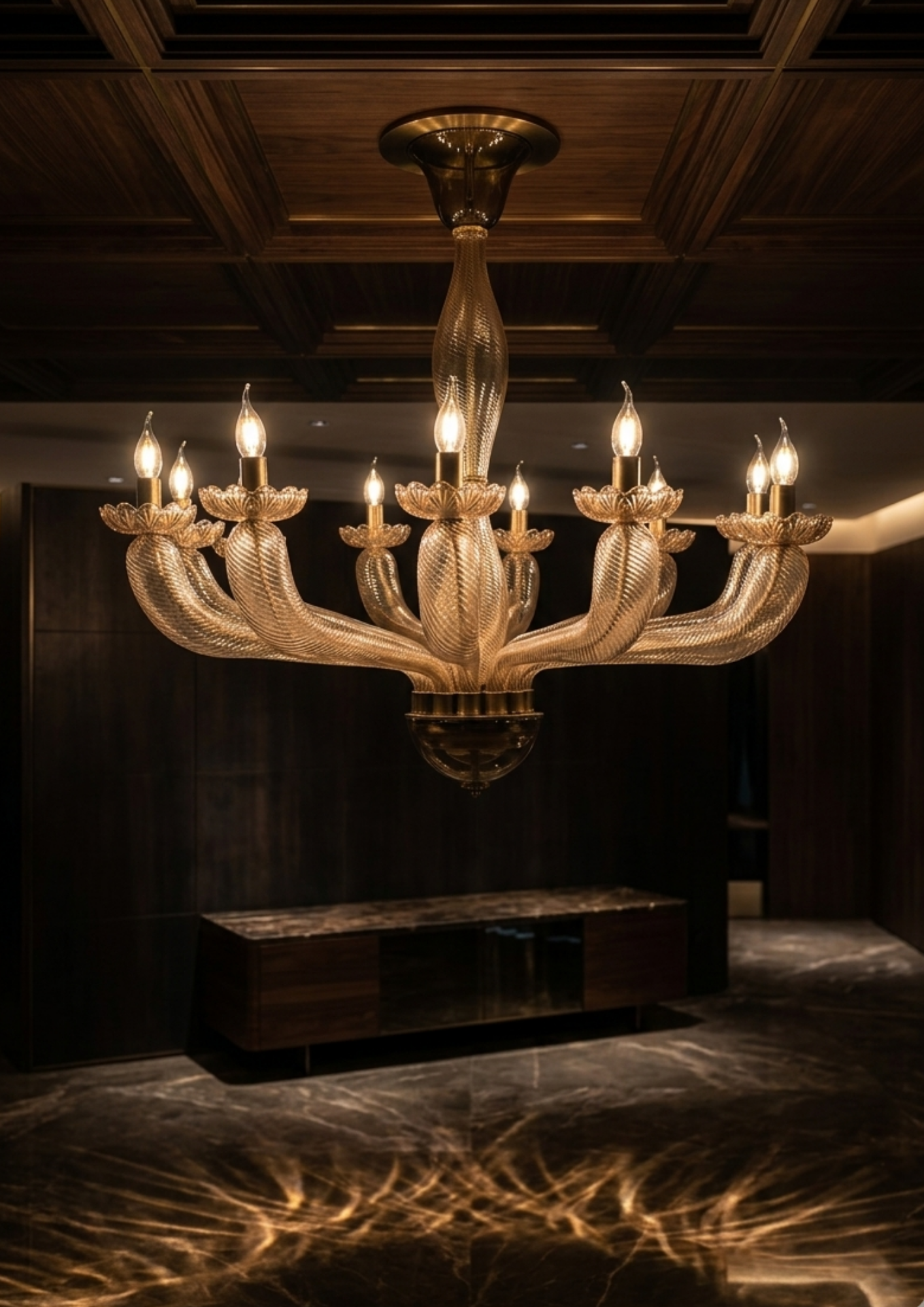 Luxurious chandelier in a dimly lit room with wooden ceiling and floor.