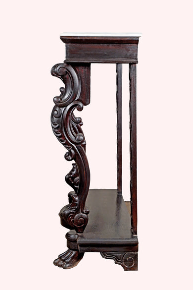 Side profile of carved wood and marble console table against pastel background – Aartaa Decor