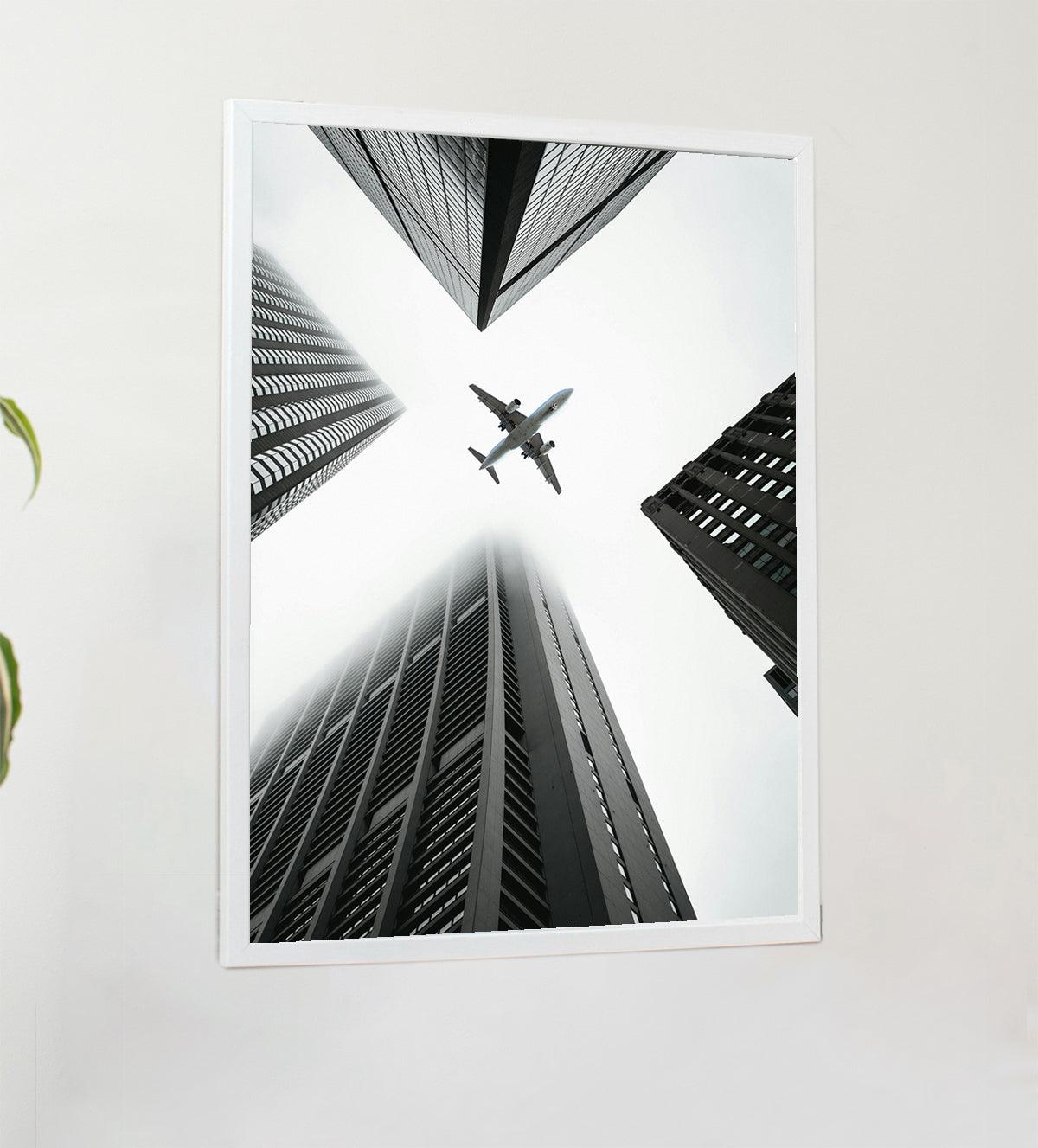 Urban Ascent is a captivating print that captures the beauty and chaos of city life. The convergence of tall buildings towards the center draws the viewer's eye upwards, while the lone bird symbolizes freedom and ambition. Hang this print to inspire your own limitless possibilities. - Aartaa decor