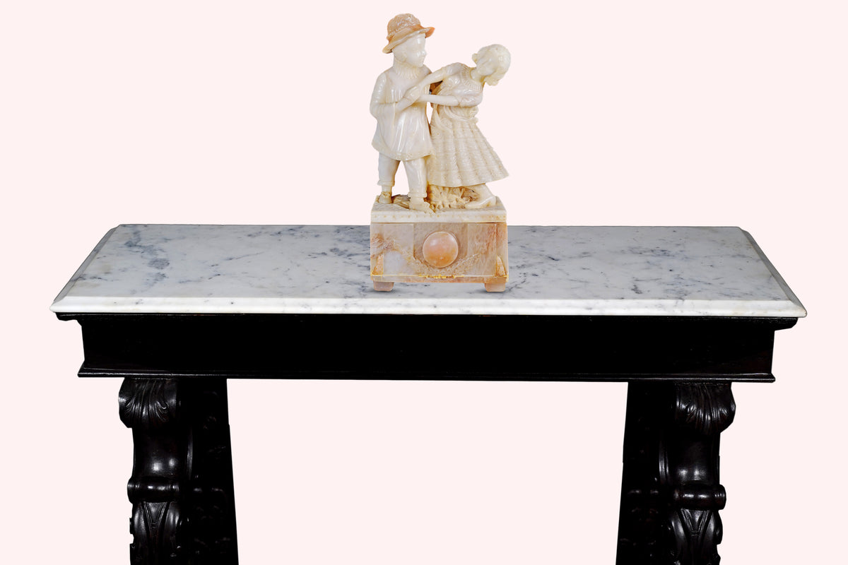 Close-up of marble top and decorative statue on antique console – Aartaa Decor