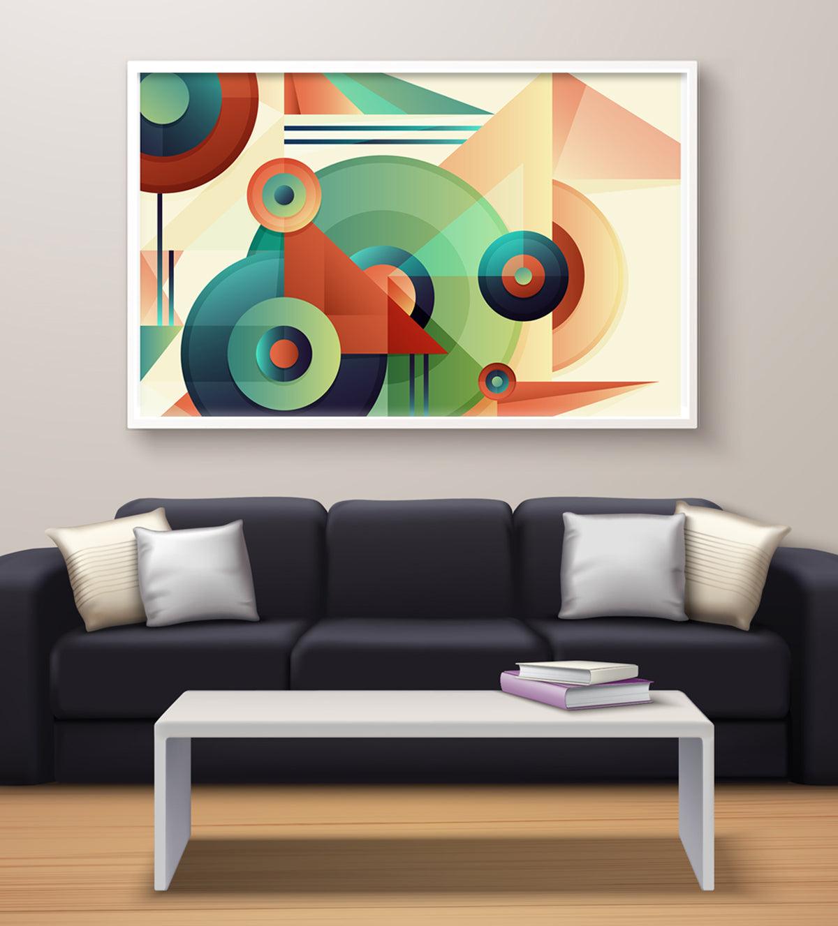 A vibrant abstract painting with bold geometric shapes in shades of orange, green, blue, and yellow, framed on a living room wall above a black sofa.