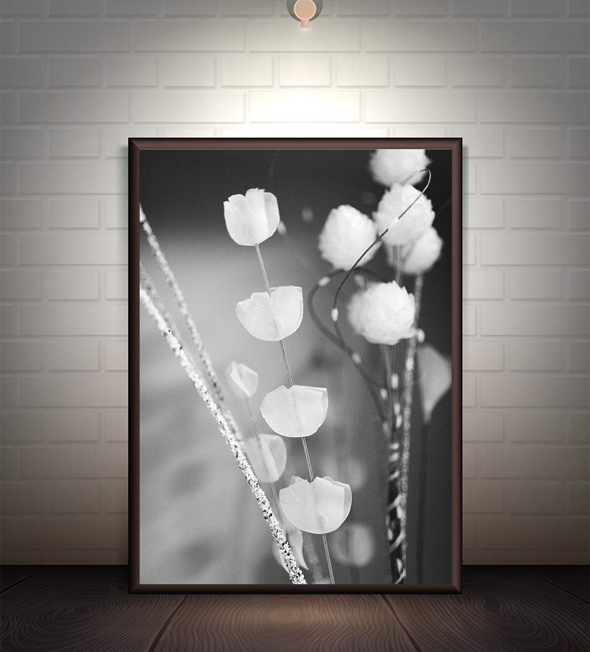 Black and white floral art print titled 'Ethereal Bloom,' featuring delicate flowers and stems in monochromatic tones for a timeless and elegant look.