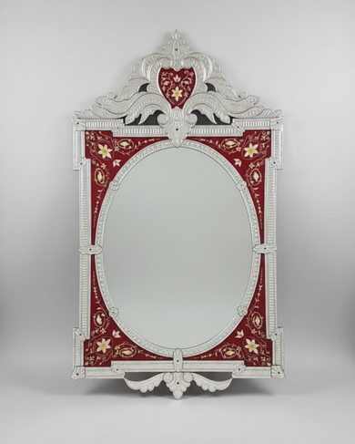 Decorative mirror with a red and gold frame on a gray background