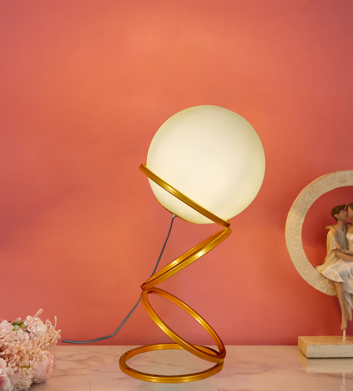 Enhance your space with the Luna Glow Modern Milky Glass LED Table Lamp. This sleek, gold spiral base with a soft-glowing glass globe adds elegance to any room. Shop now for cozy, energy-efficient lighting - Aartaa decor