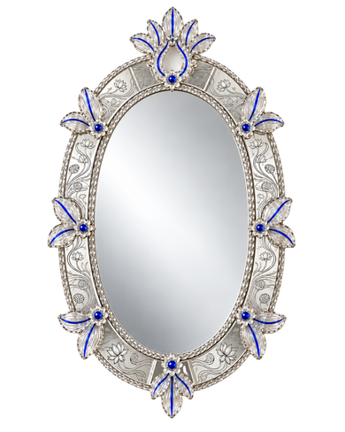 An ornate oval wall mirror with a silver-toned filigree frame decorated with blue enamel and small blue gemstone accents, shown against a plain white background.