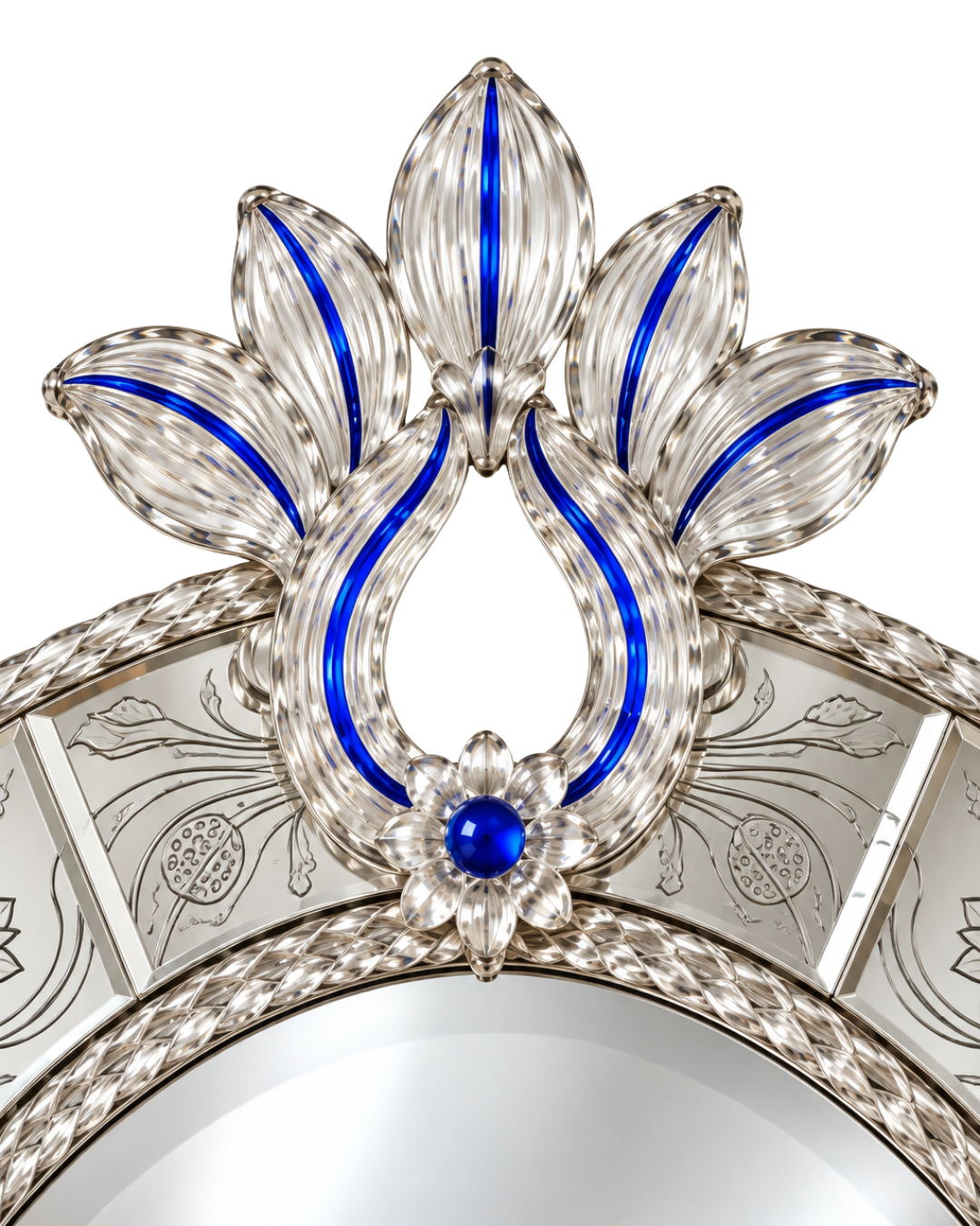 Close-up of an ornate silver-toned decorative frame or mirror border with sculpted floral and leaf motifs, bright blue inlay accents, and a central blue gemstone on a white background.