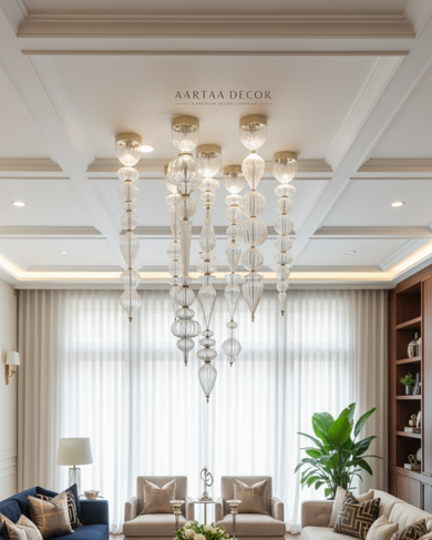 Luxurious living room with a chandelier, sofa, and armchair.